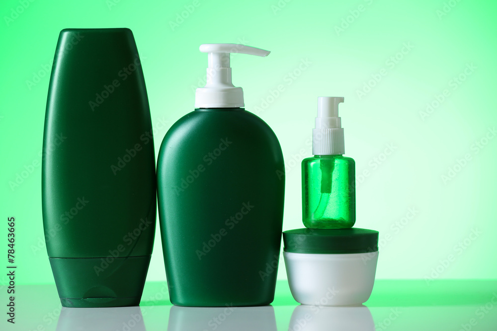 Cosmetic bottles on bright background Cosmetic bottles on bright background