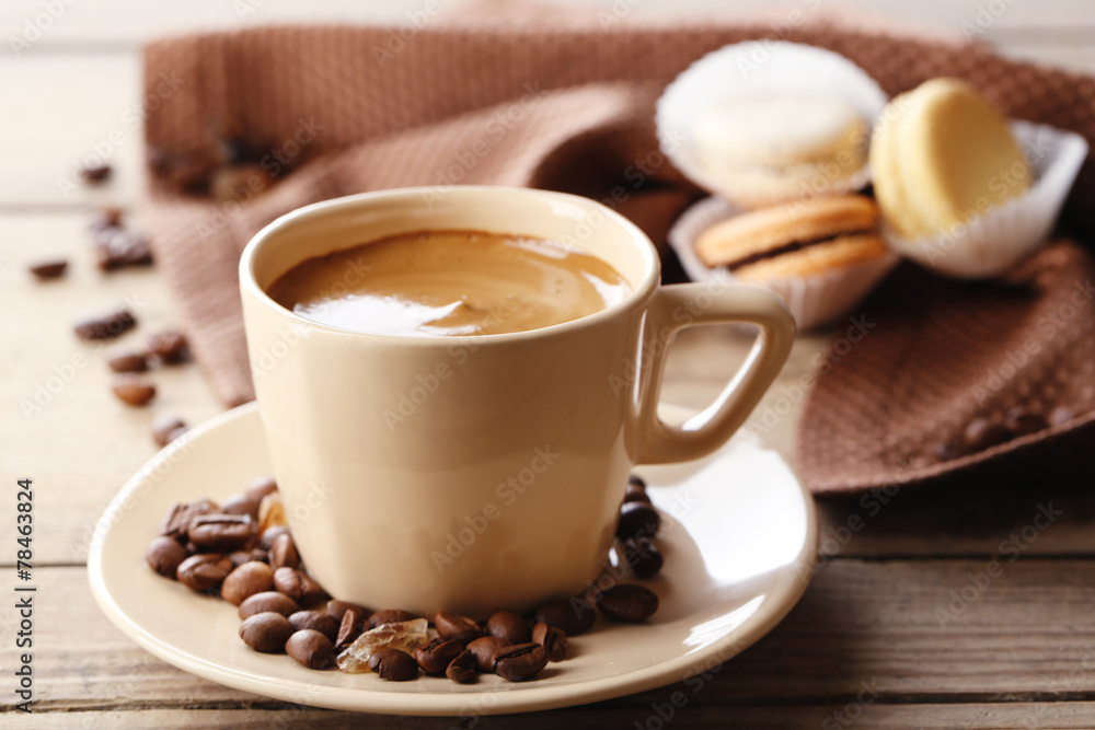 Gentle colorful macaroons and coffee in mug Gentle colorful macaroons and coffee in mug