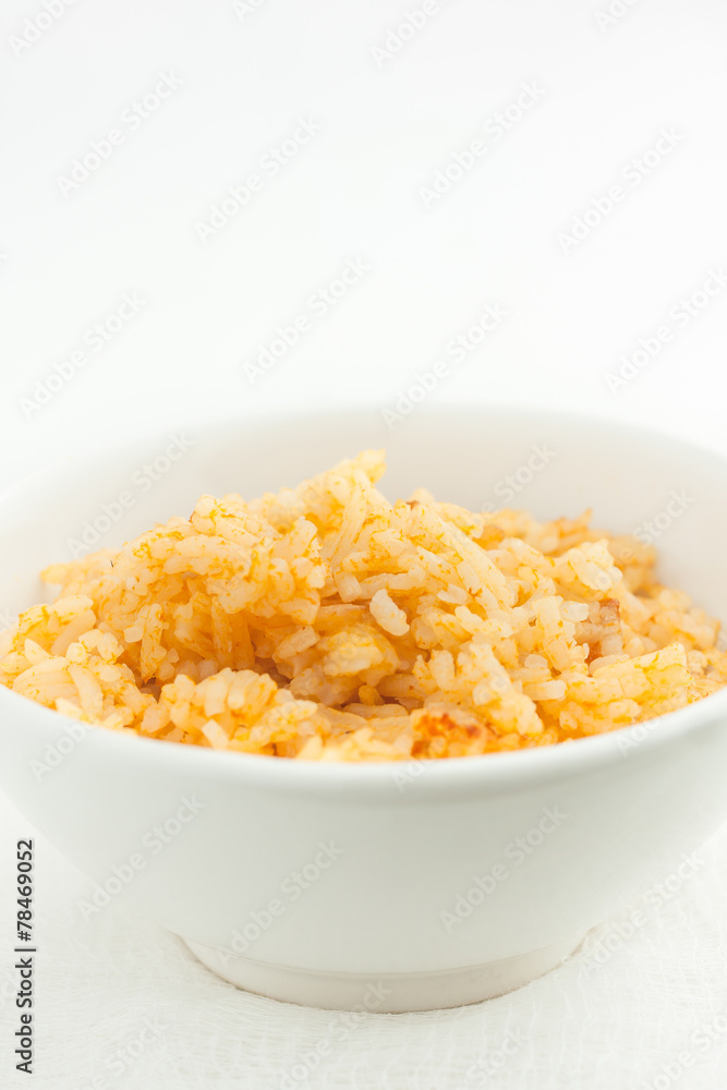 close up of risotto in a white bowl, room for text