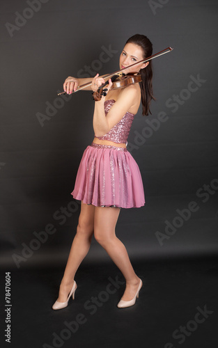 violinist in pink corset