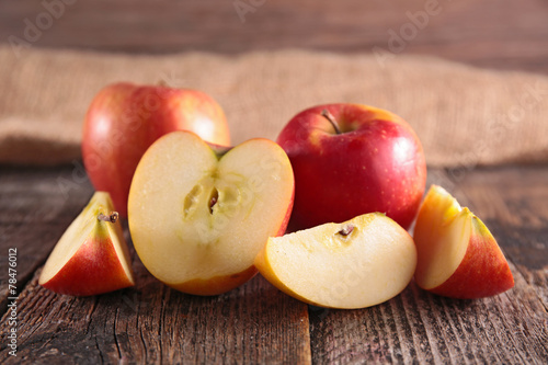 fresh red apple on wood
