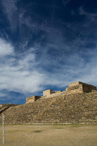 Monte Alban Oaxaca Mexico pyramid slope and sky with clouds photo