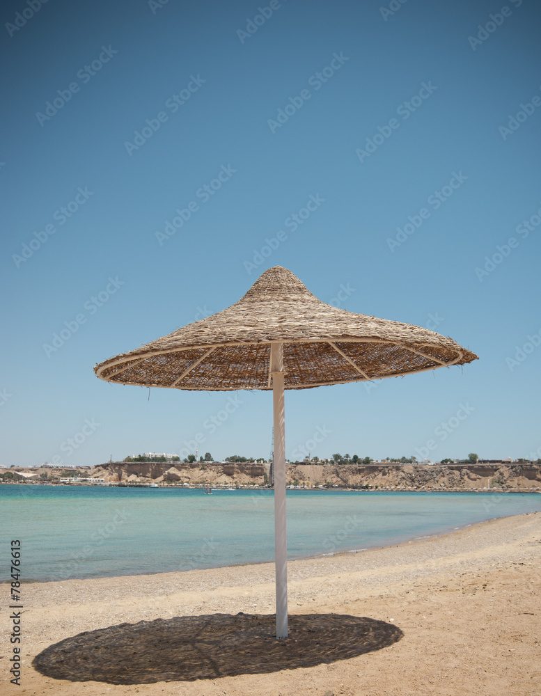 Tropical beach with umbrella