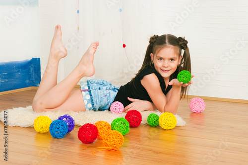 girl with multi-colored balls