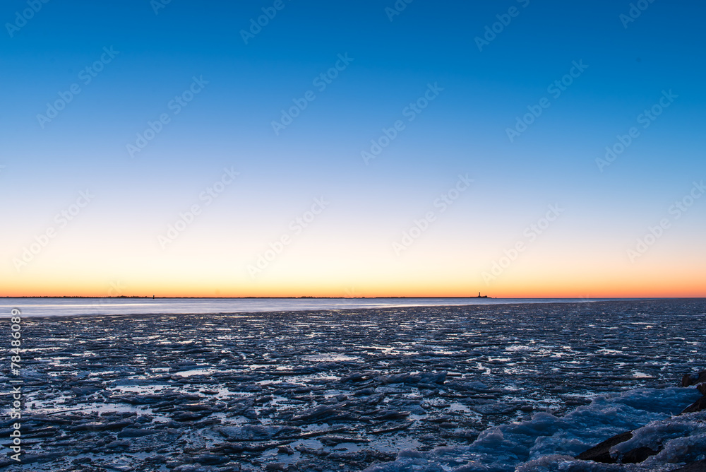 sunset over frozen sea