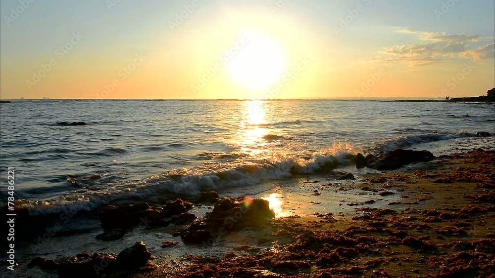 Sun reflecting off the sea on a beach, Puerto Sherry, Spain Sun reflecting off the sea on a beach, Puerto Sherry, Spain