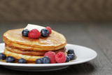 Classic pancakes with butter berrys and maple syrup