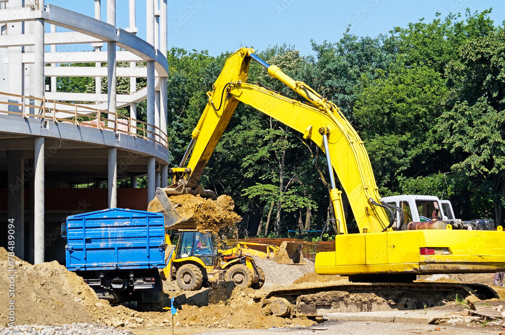 Excavator at the construction site Excavator at the construction site