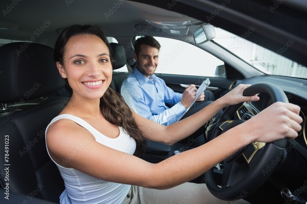 Young woman getting a driving lesson