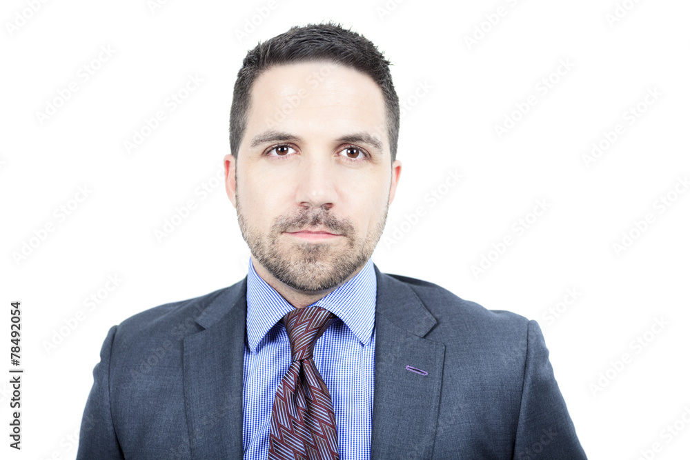 A beautiful business man standing against grey background A beautiful business man standing against grey background