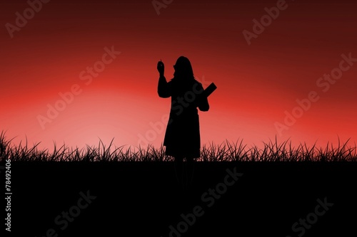 Composite image of silhouette of doctor pointing with pen