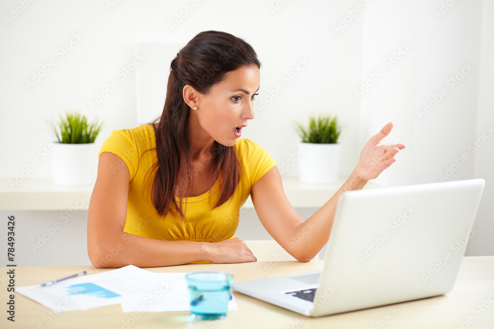 Sitting female receptionist using her computer Sitting female receptionist using her computer