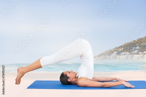 Fit woman doing the plough posture in fitness