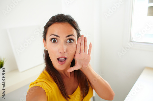 Lovely woman taking a funny selfie with phone