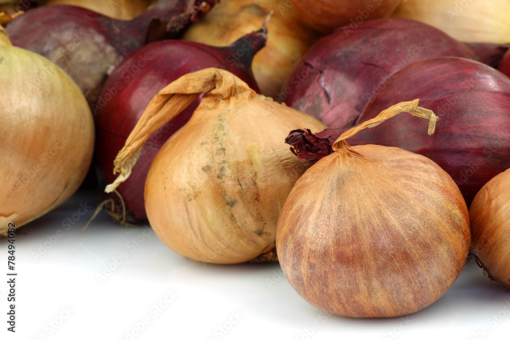 red and brown onions on a white background