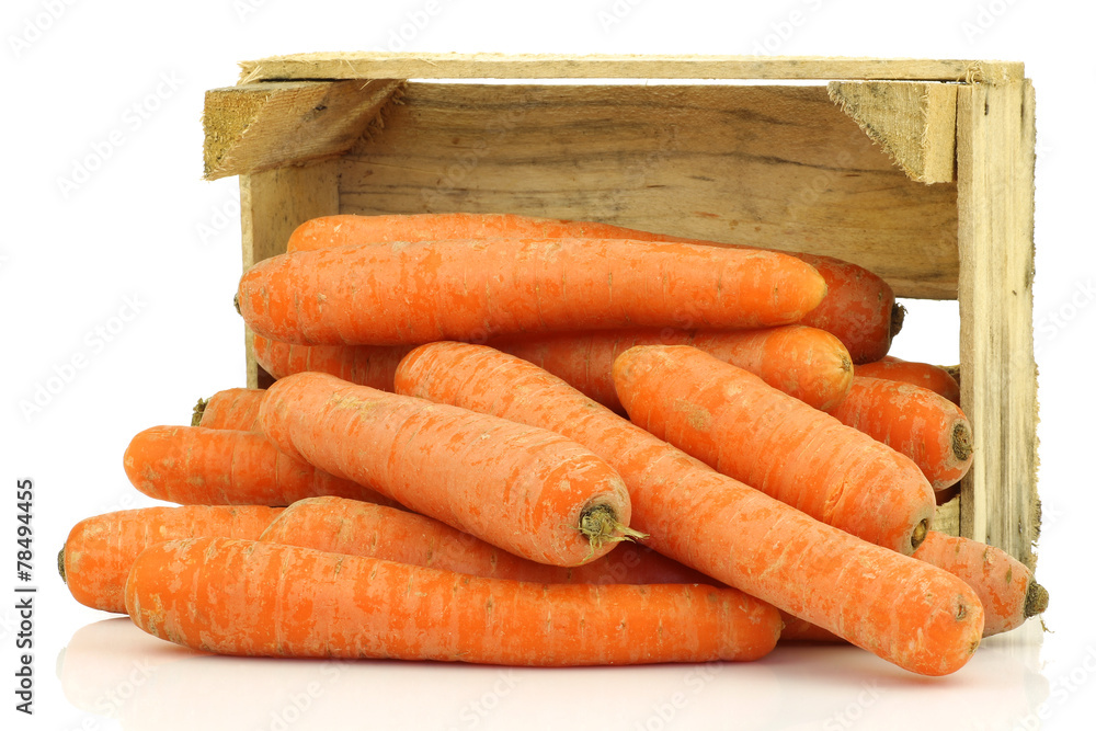 fresh winter carrots in  a wooden box on a white background - obrazy, fototapety, plakaty 