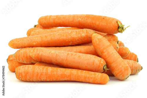 bunch of fresh winter carrots on a white background