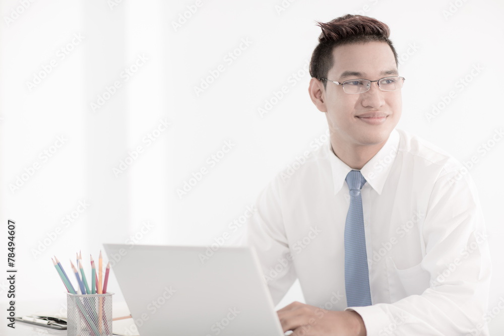 young asian businessman working in office young asian businessman working in office