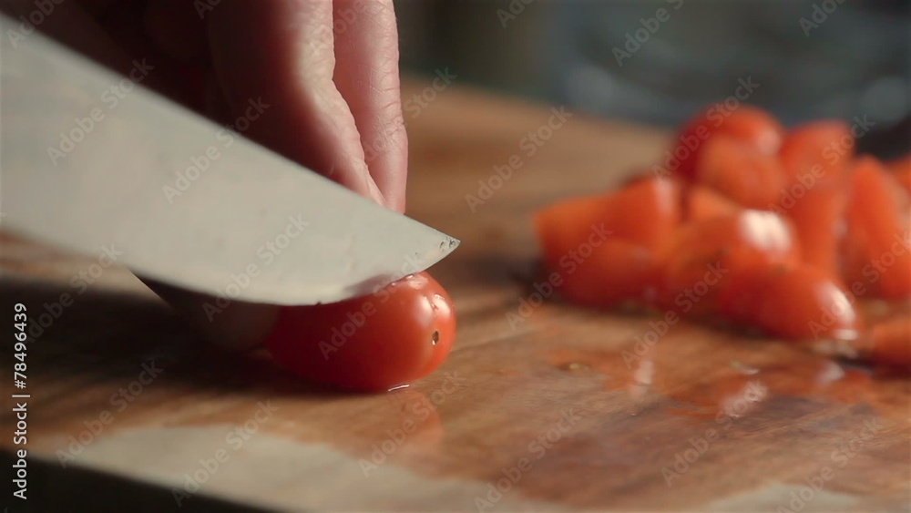 Slow motion of little tomatoes slicing. Find similar in our port Slow motion of little tomatoes slicing. Find similar in our port