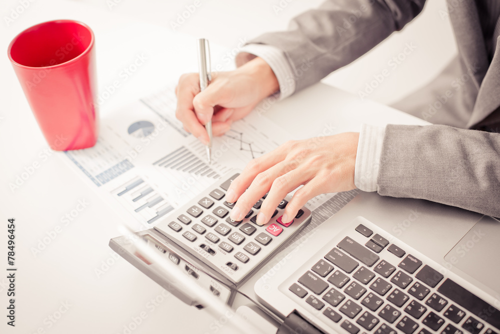 Businessman analyzing investment charts with laptop. Accounting Businessman analyzing investment charts with laptop. Accounting