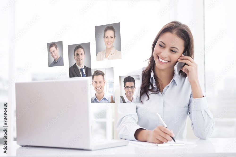 Composite image of happy businesswoman using laptop at her desk Composite image of happy businesswoman using laptop at her desk
