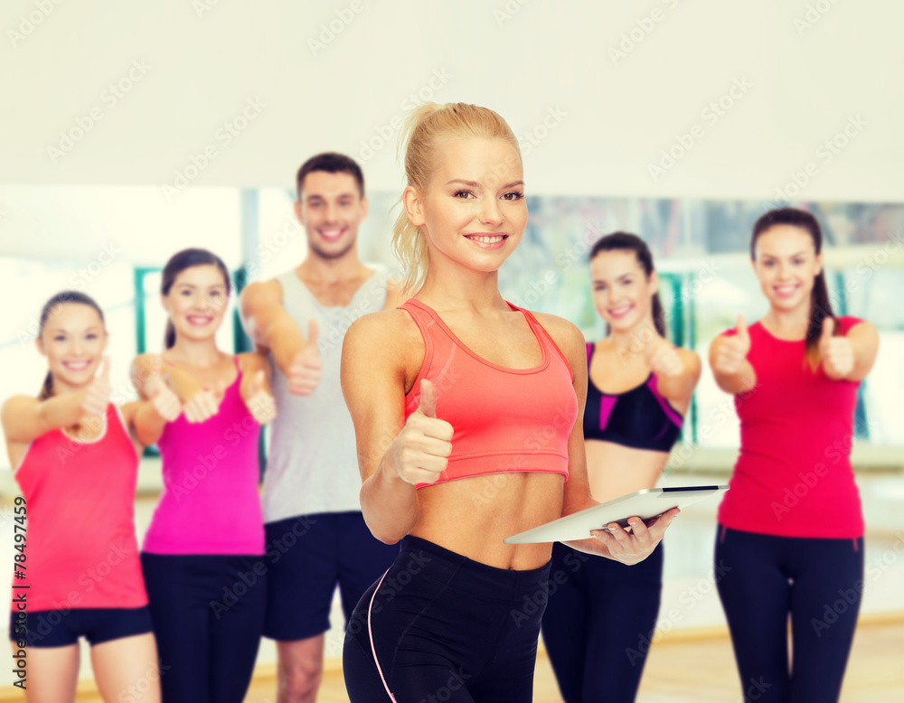 smiling sporty woman with tablet pc computer smiling sporty woman with tablet pc computer