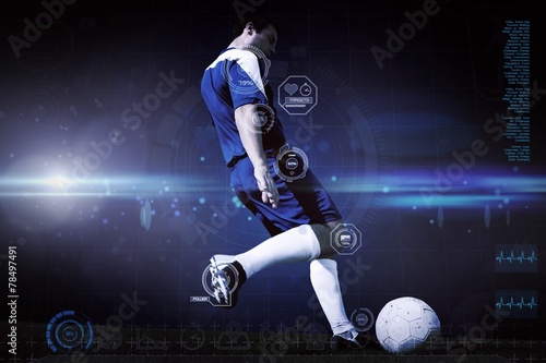 Composite image of football player kicking ball © WavebreakmediaMicro