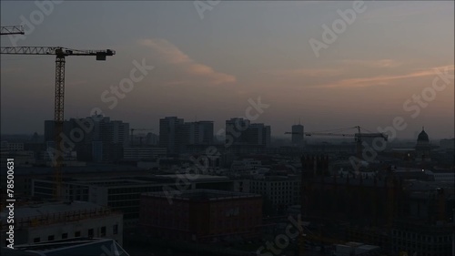 Berlin city sunset cranes panning shot