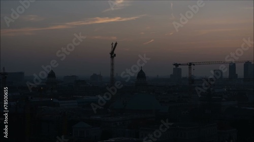 Berlin city sunset cranes panning shot right