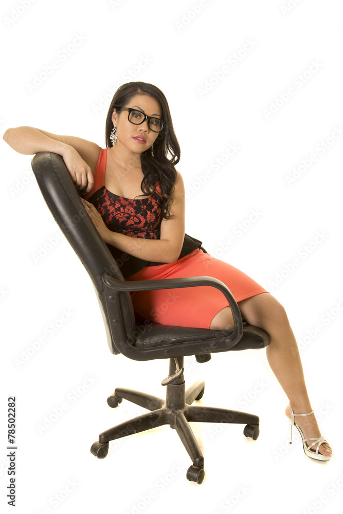 Fototapeta premium Asian woman with glasses in dress sitting serious