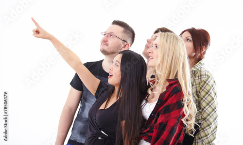 young Chinese woman points a finger at something a group of youn