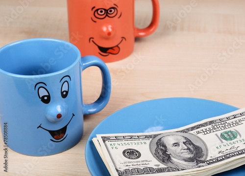 Obraz na płótnie Cup and dollar. The cup is looking for dollars w salonie