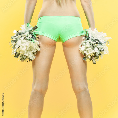 sexy woman cheerleader over yellow