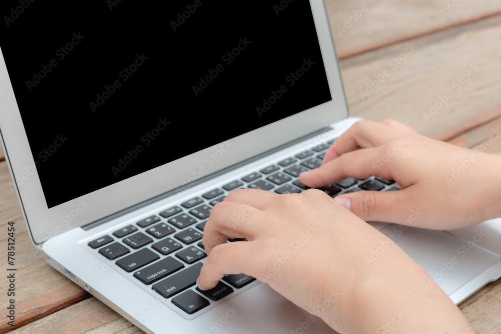 Closeup of business woman hand typing on laptop keyboard Closeup of business woman hand typing on laptop keyboard