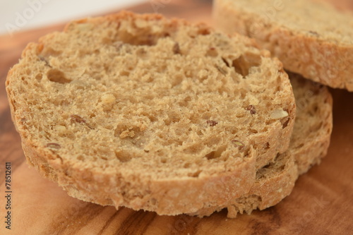 A slice of bread on a chopping board.