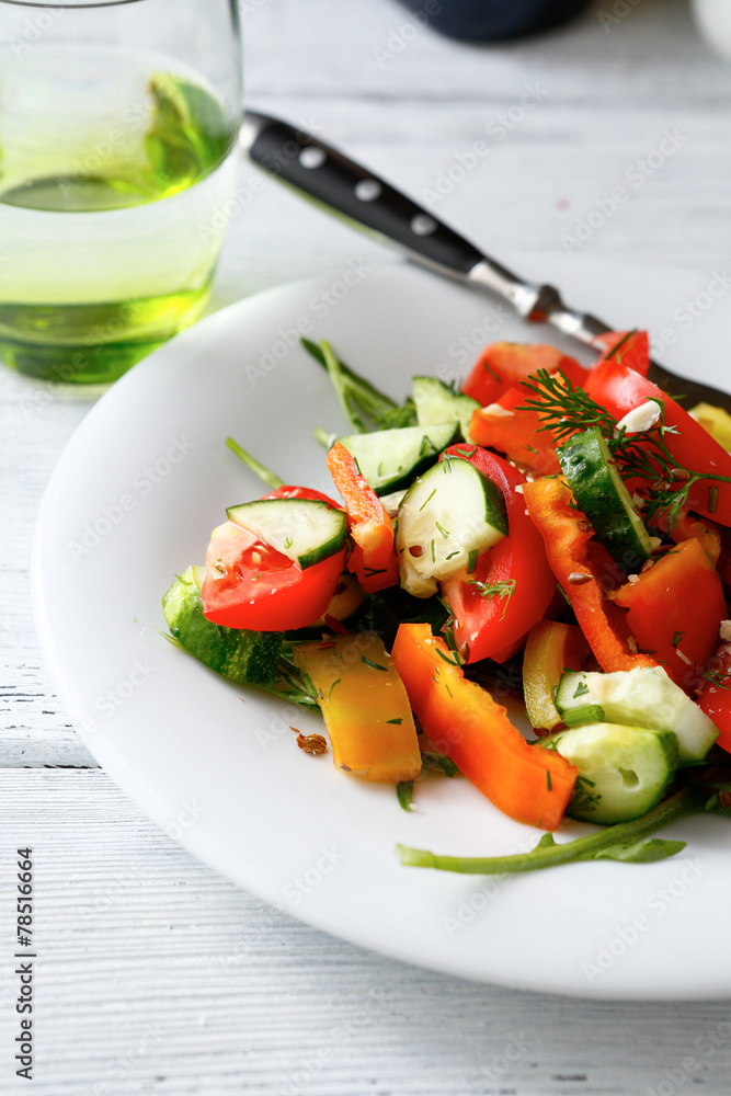 Salad with tomatoes, cucumbers and arugula Salad with tomatoes, cucumbers and arugula