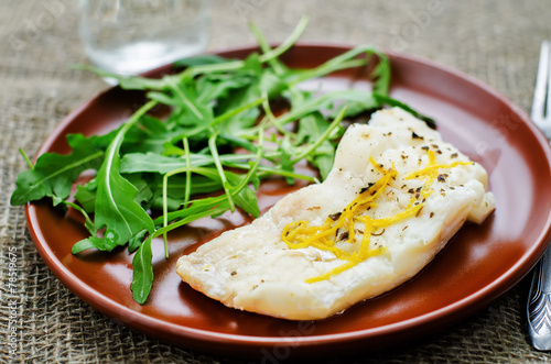 cod baked with lemon and spices with arugula and mashed green pe