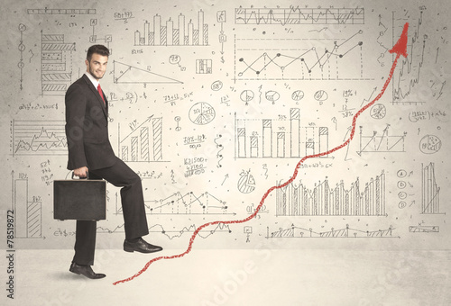 Business man climbing on red graph arrow concept