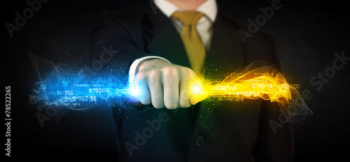 Man holding colorful glowing data in his hands