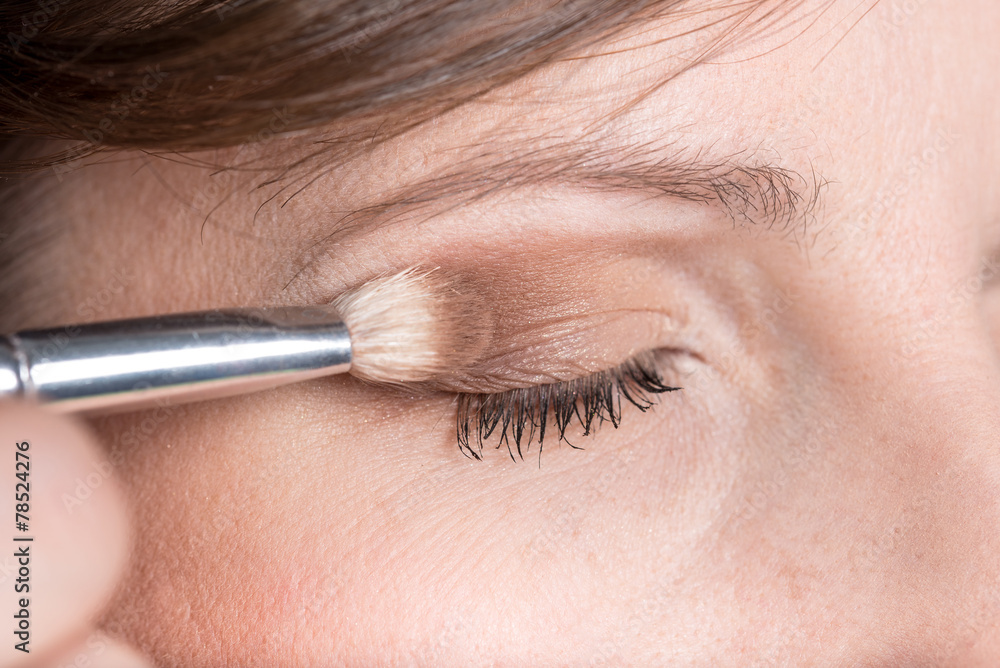 Fototapeta premium Closeup of applying professional make up