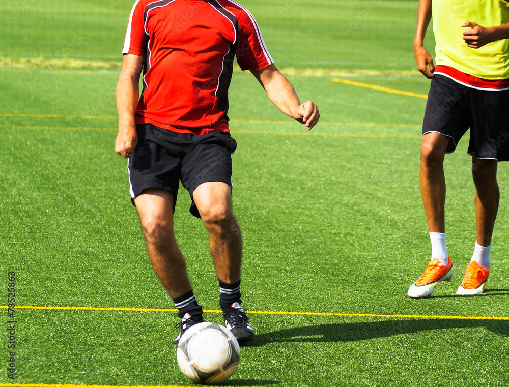 Obraz premium Young men are playing soccer