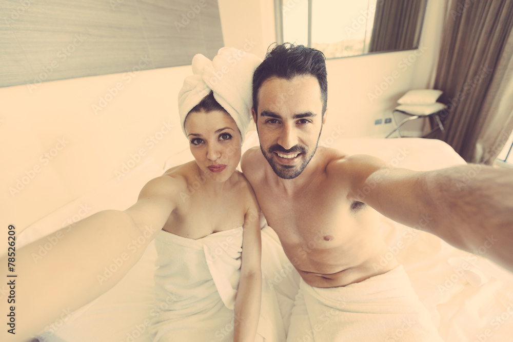 Fototapeta premium Couple Taking Selfie after Shower