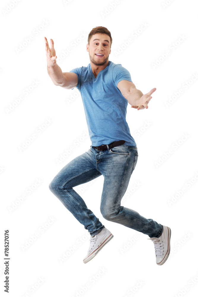Handsome man jumping for joy. Handsome man jumping for joy.