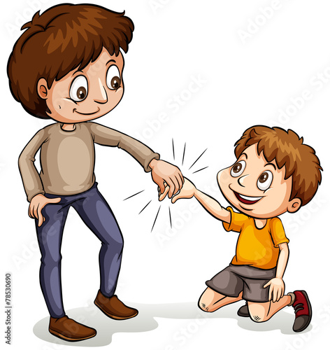 A man helping a young boy