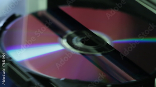 Close up view of CD - DVD in and out of the computer