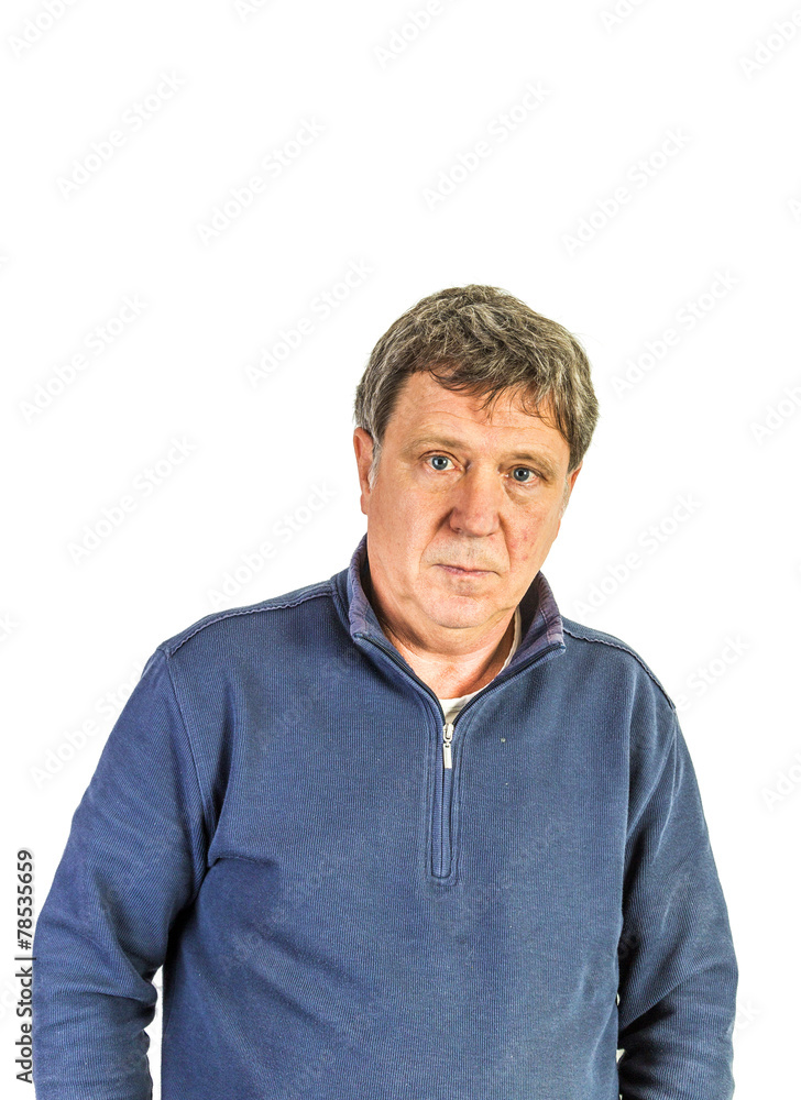 man in blue sweater in front of white wall man in blue sweater in front of white wall