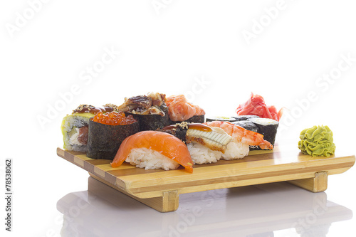 Sushi rolls and gunkans on a gete on white background photo