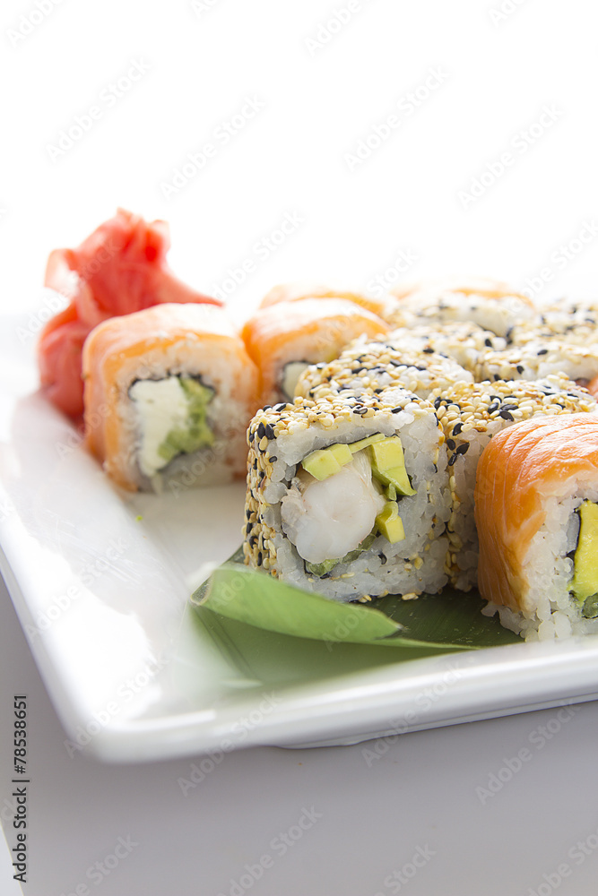 Seafood Maki sushi in white plate isolated on white background Seafood Maki sushi in white plate isolated on white background