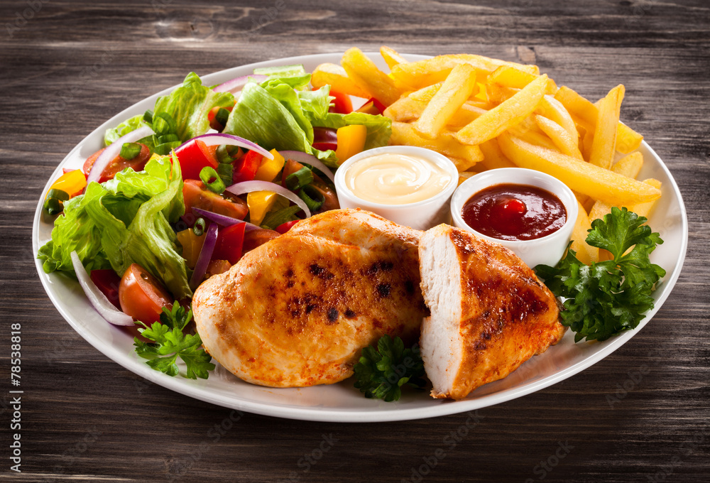 Fried chicken fillets, boiled potatoes and vegetable salad Fried chicken fillets, boiled potatoes and vegetable salad