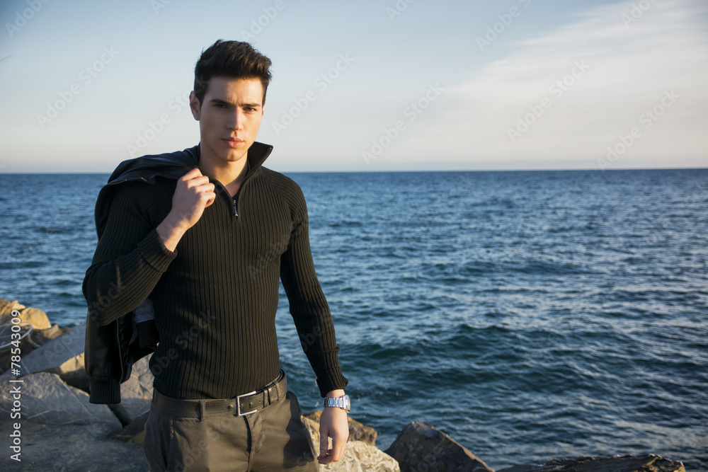 Handsome fashionable young man at the seaside Handsome fashionable young man at the seaside